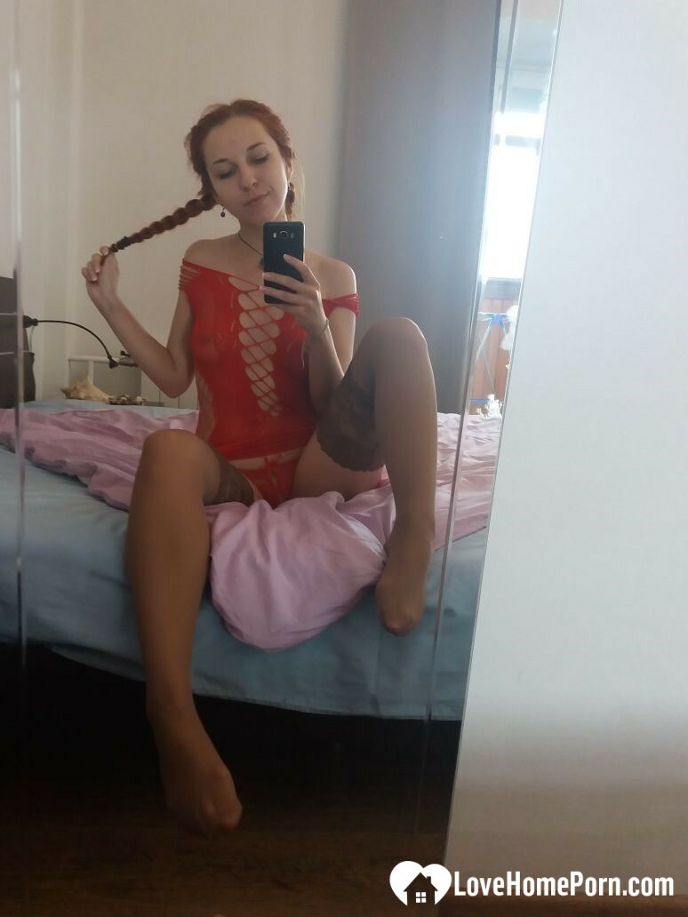 Smoking redhead teases in stockings in the bedroom — 28
